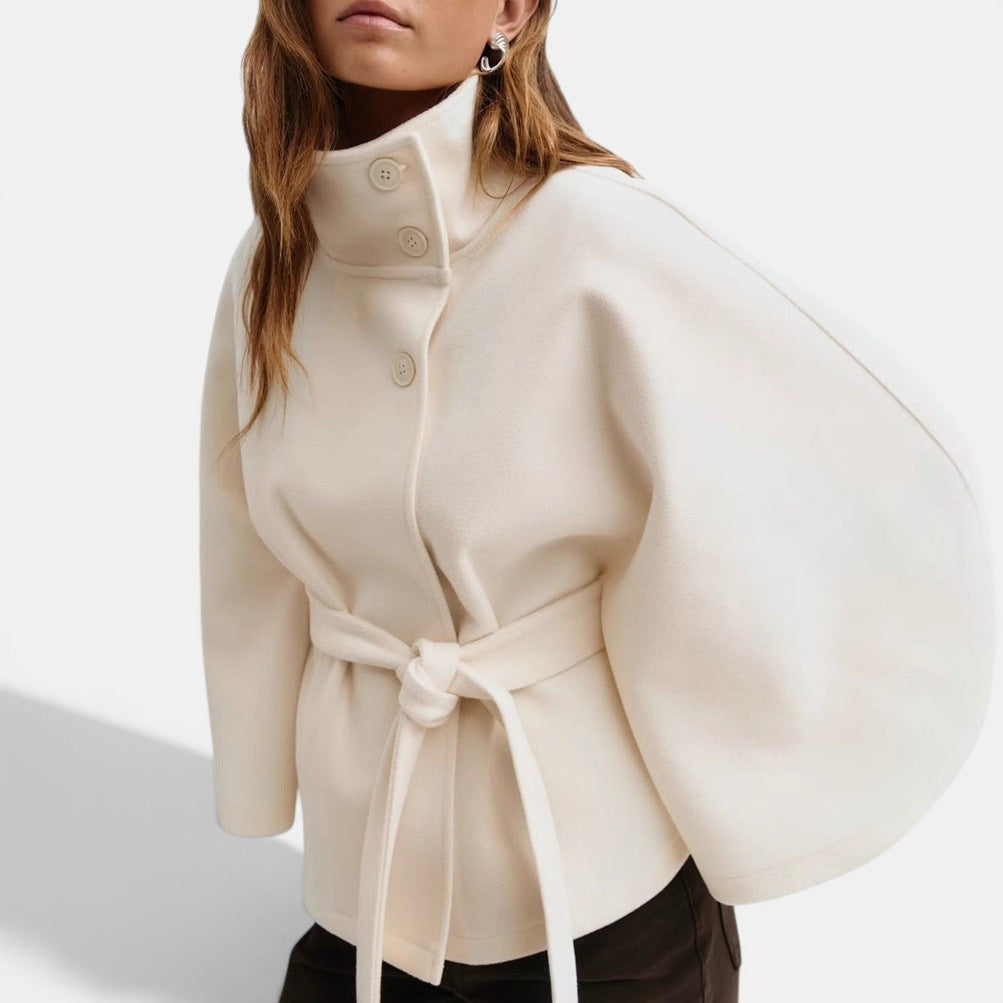 Allzom cream batwing sleeve coat with high neck, buttons and belt, made of polyester.