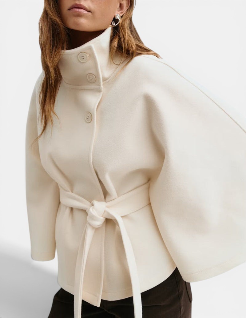 Allzom cream batwing sleeve coat with high neck, button detail and tie belt, made from polyester.