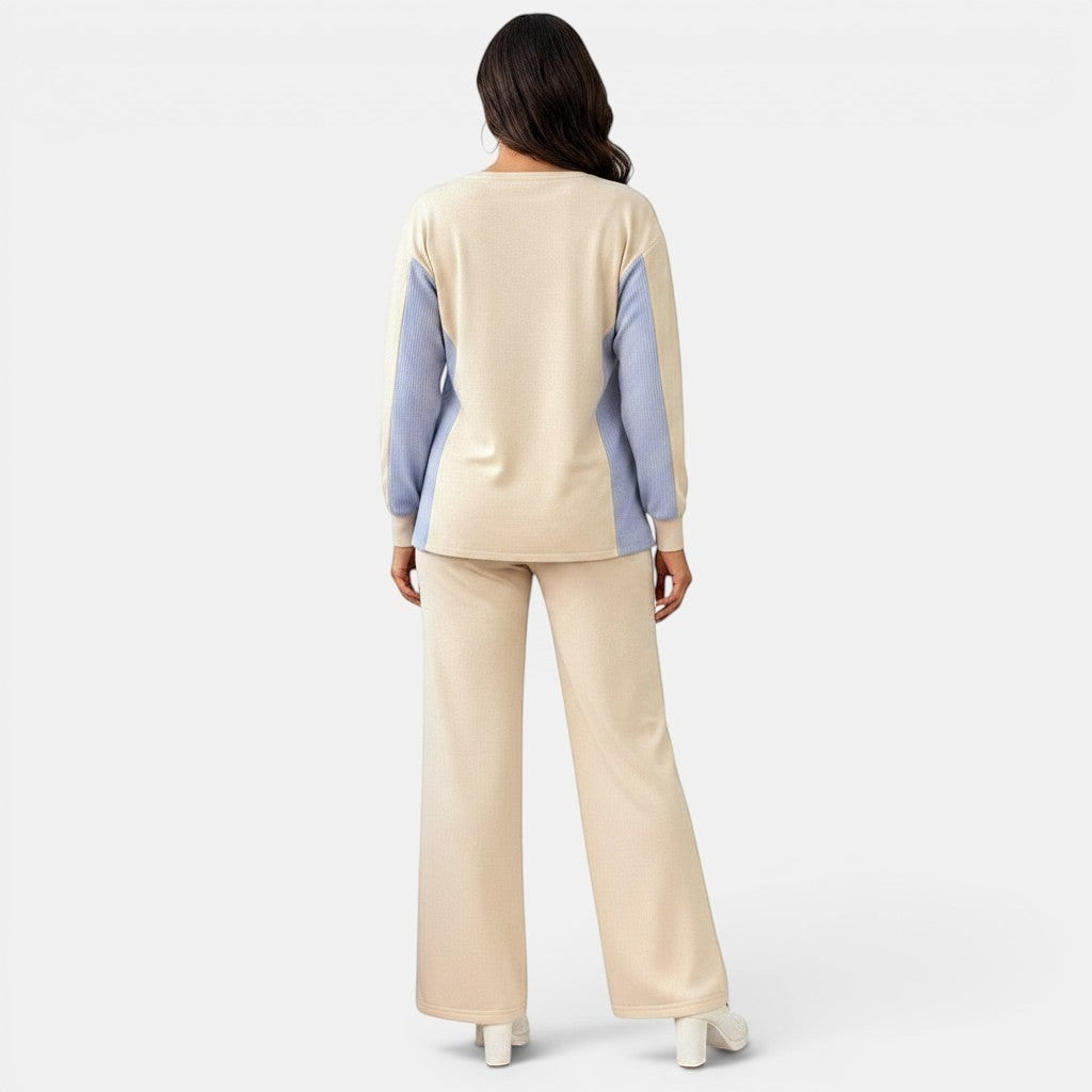 Allzom beige and light blue asymmetric hem top and wide-leg pants set with pockets. Model from behind.
