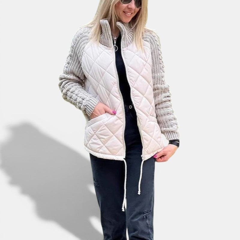 Allzom women's beige quilted jacket with grey knitted sleeves and stand collar, zipped front, pockets.