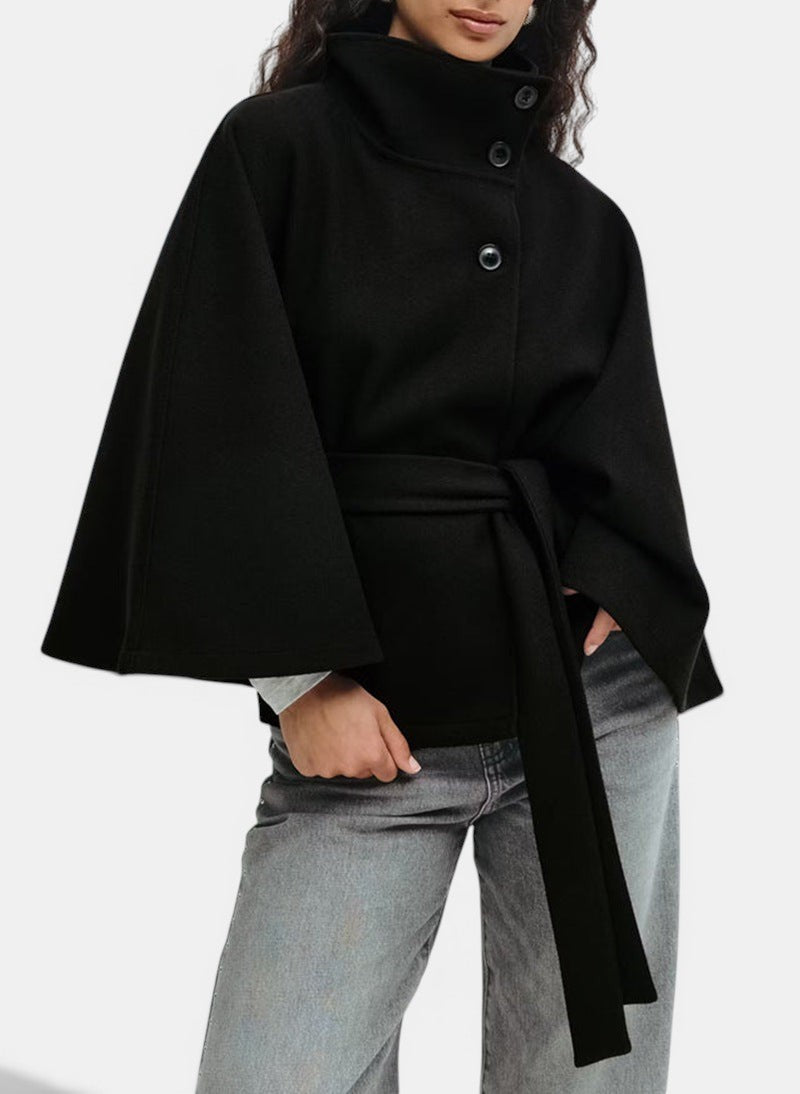 Allzom black polyester coat with high neck, batwing sleeves, belt and button details.