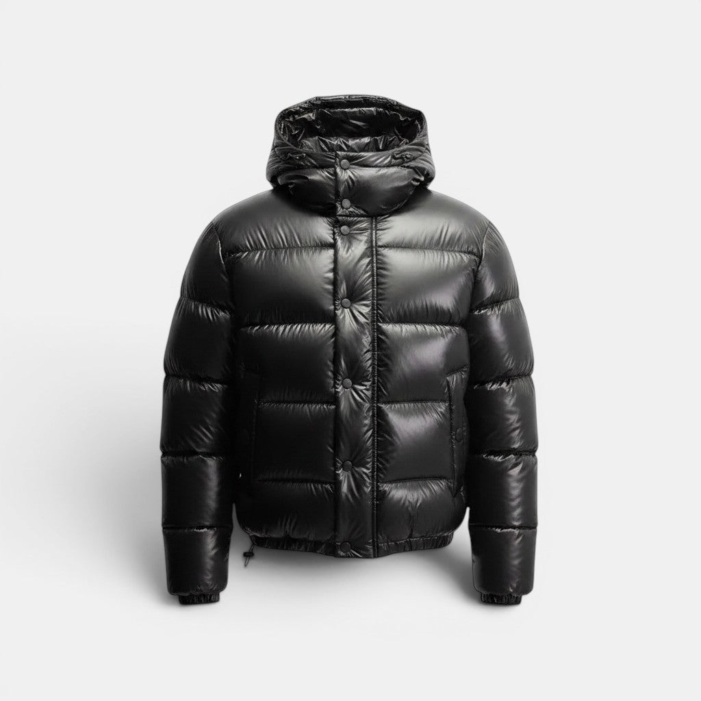 Allzom black hooded puffer jacket with snap button closure and drawstring hem. Made of shiny cotton.