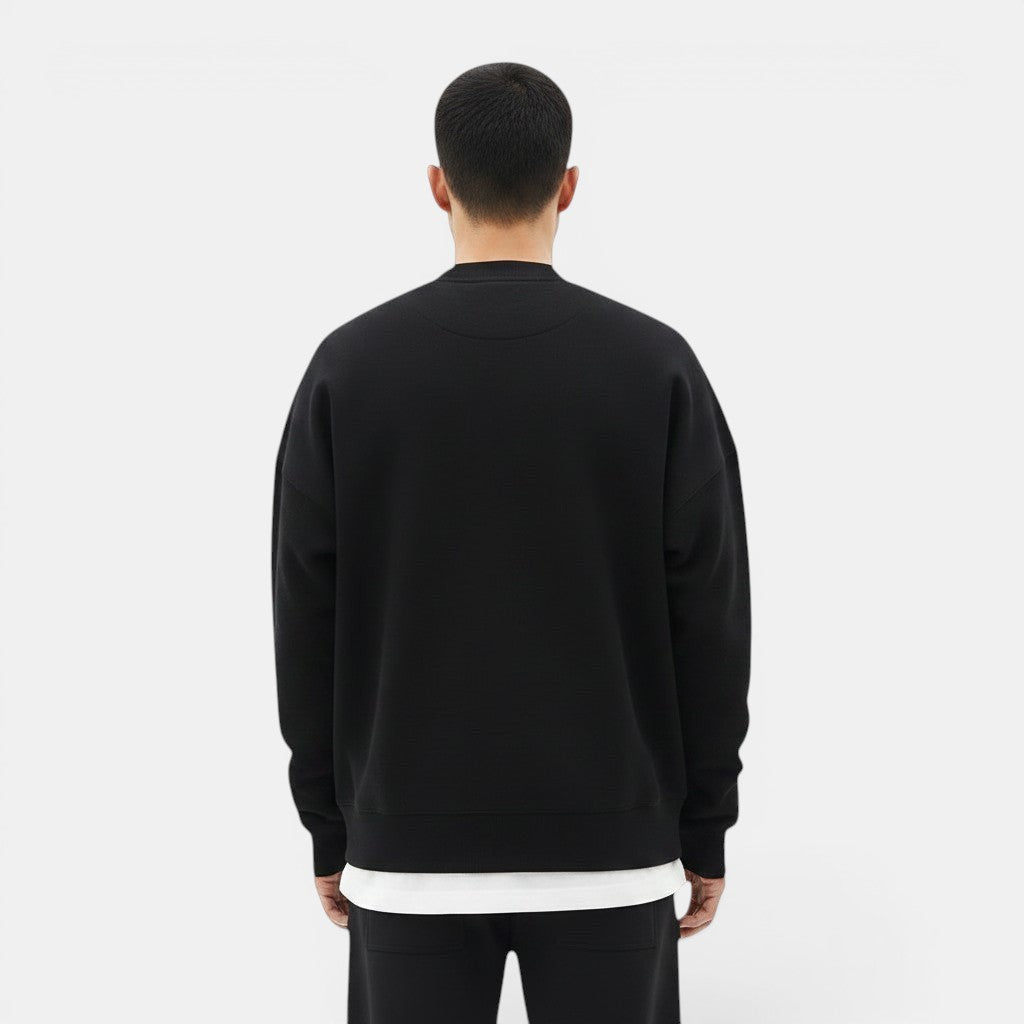 Allzom Men's black loose-fit round-neck pullover sweater made from soft knitwear.