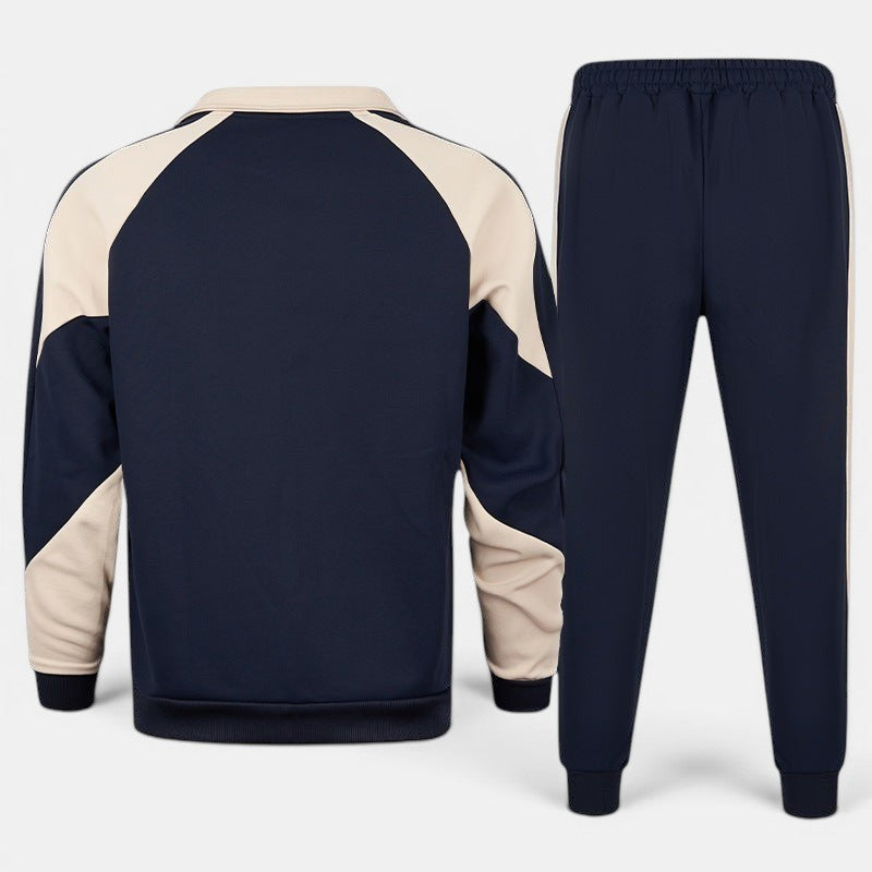 Conjunto de fato de treino Allzom em azul-marinho e bege, com casaco de manga comprida e calças compridas, com bloco de cores.