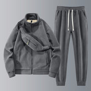 Conjunto de fato de treino Allzom em polar cinzento escuro, com casaco de lapela e calças a condizer. Inclui uma bolsa de cintura.