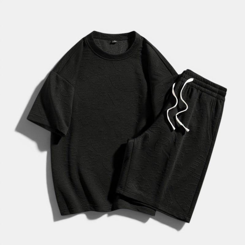 Conjunto Allzom de T-shirt preta de manga curta e calções com padrão texturizado, 98% poliéster, 2% spandex.