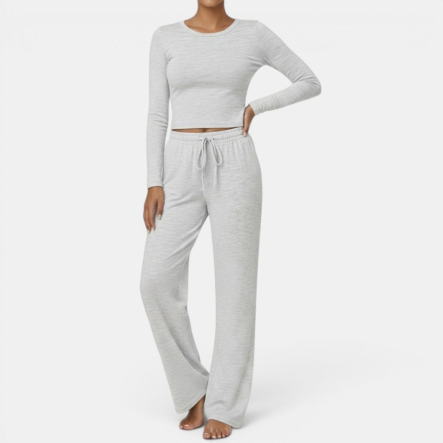 Conjunto de yoga Allzom de duas peças para mulher com top de manga comprida e calças de perna larga em cinza claro.