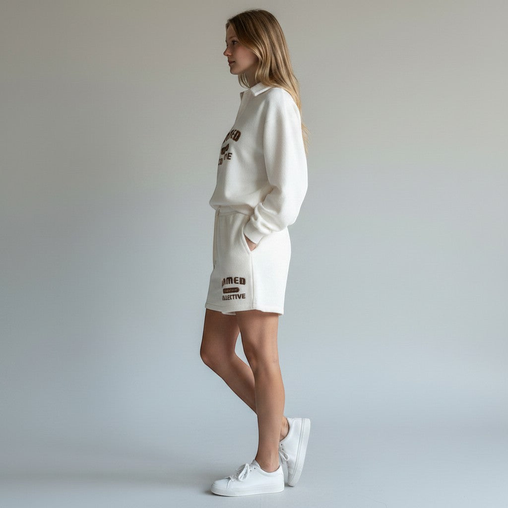 Allzom cream corduroy long-sleeve sweater with collar and brown graphic detail. Relaxed fit, casual campus style.