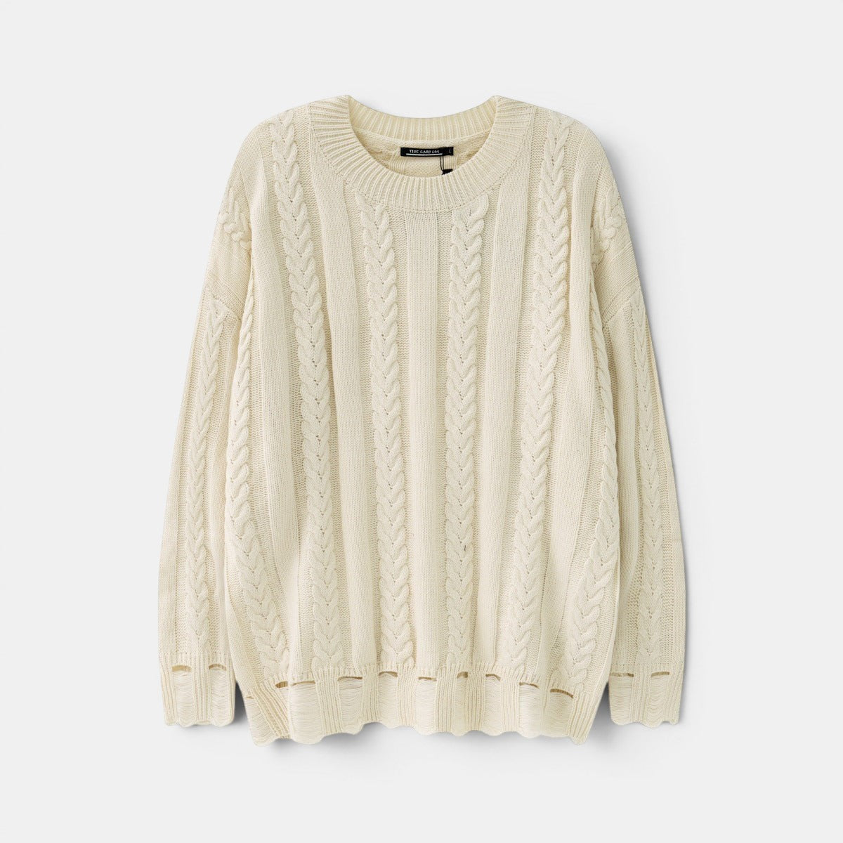 Allzom cream cable knit sweater with distressed hem and round neck. Textured, artisanal knit.