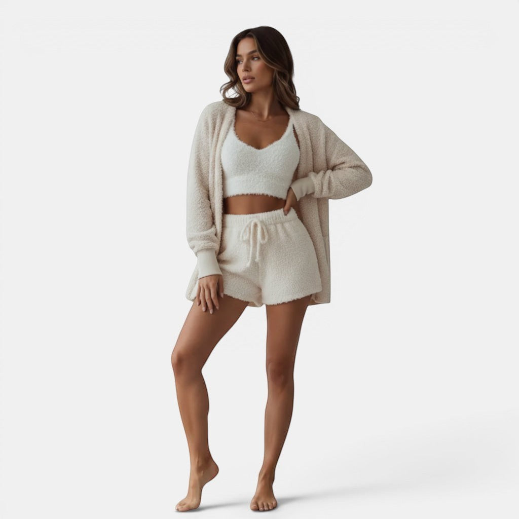 Allzom women's 3-piece cream fluffy pajama set with crop top, tank and shorts. Model wearing loungewear.