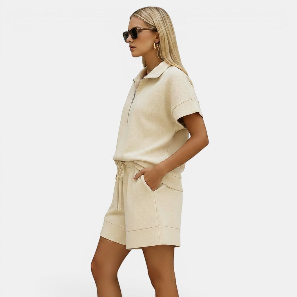 Allzom women's cream short sleeve half-zip sweatshirt and matching shorts two-piece set.