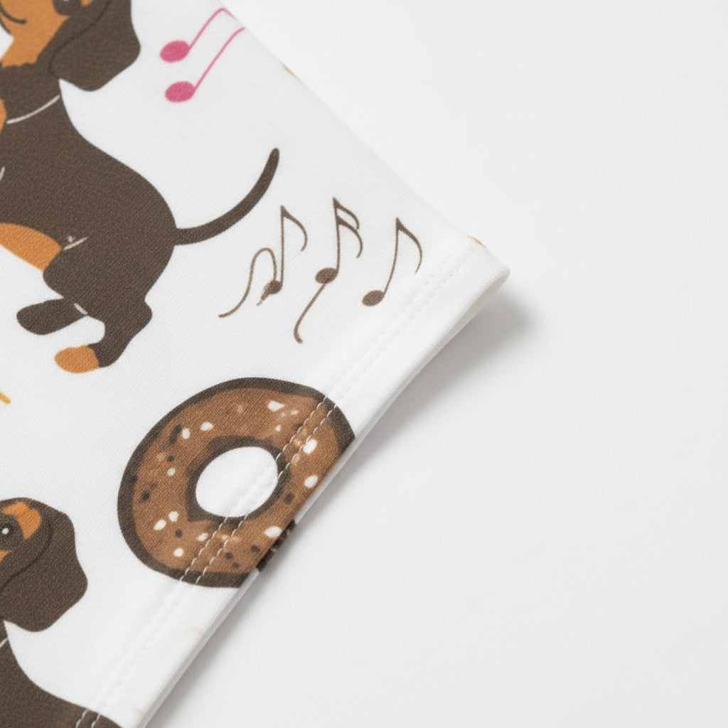 Allzom women's white pajama suit with dachshunds and donuts print. Soft, comfortable fabric for lounging.