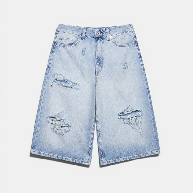 Allzom light wash denim culottes with distressed details and mid-waist fit.