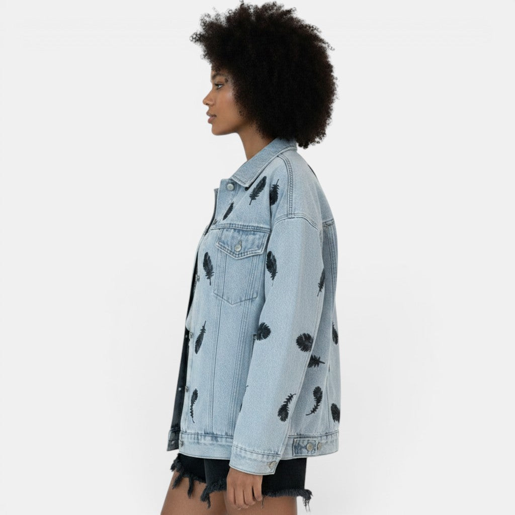 Allzom light wash denim jacket with black feather print, lapel collar and loose fit.