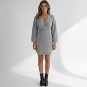 Allzom grey cable knit button-front mini dress with lantern sleeves and V-neck. Model is wearing black boots.