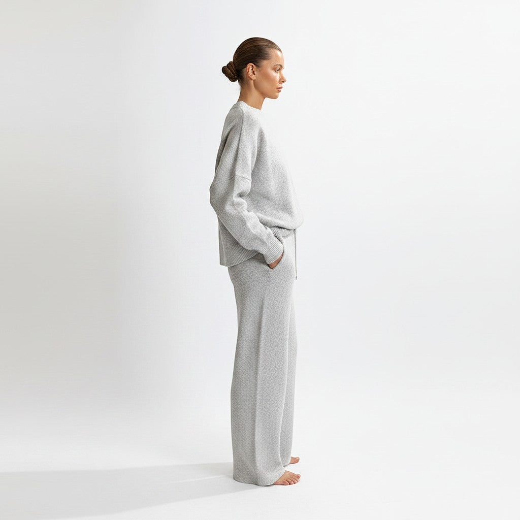 Allzom grey knit sweater and wide-leg pants set with round neck and backless detail. Model is wearing a size S.