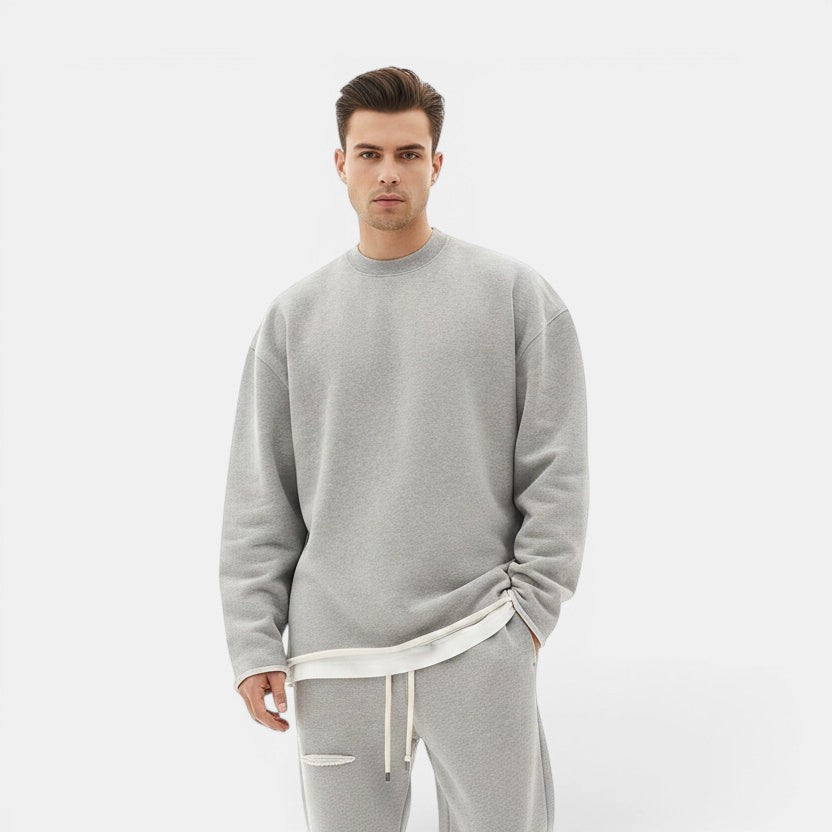 Allzom men's grey round neck knit sweater with loose fit and layered hem detail.
