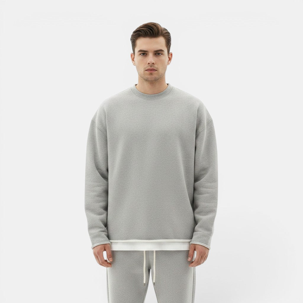 Allzom Men's grey round neck knit sweater with a loose fit, layered over a white t-shirt.