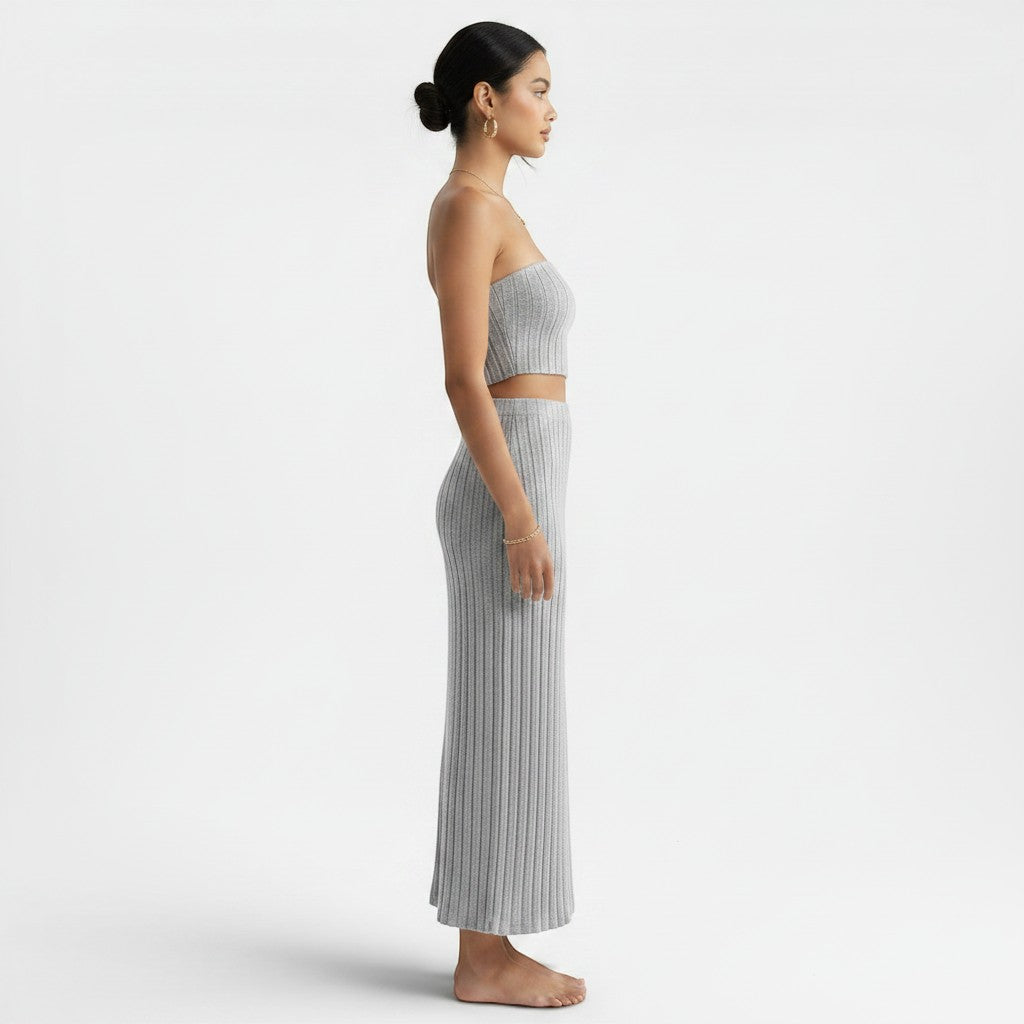 Allzom grey ribbed knit strapless crop top and maxi skirt set on a model.