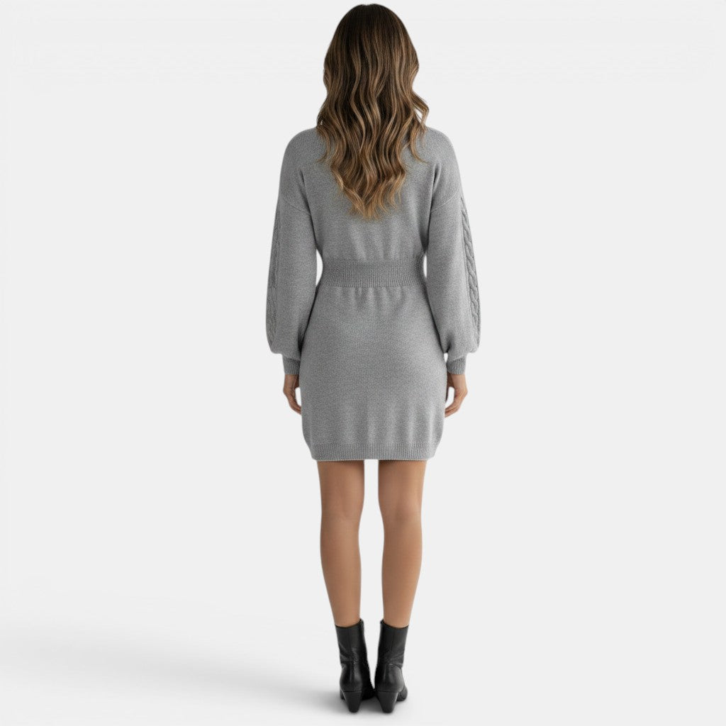 Allzom grey knitted dress with cable knit lantern sleeves and a cinched waist, worn by a model from behind.