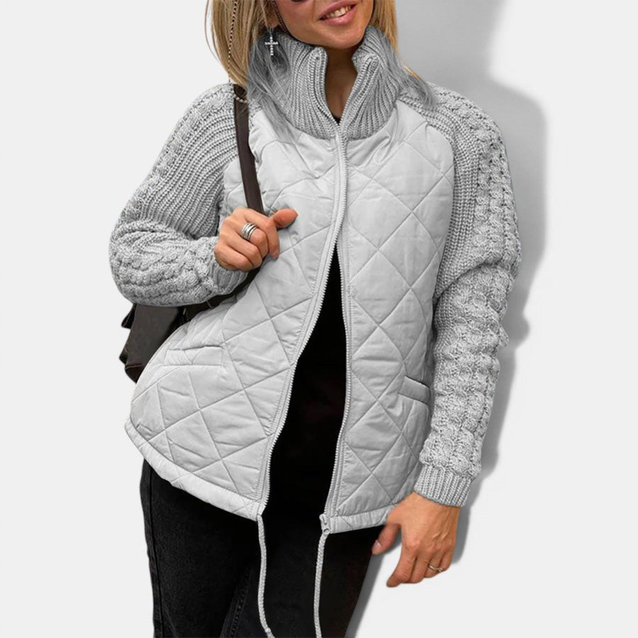 Allzom women's light grey quilted jacket with knitted sleeves and stand-up collar, featuring a zipper closure and pockets.