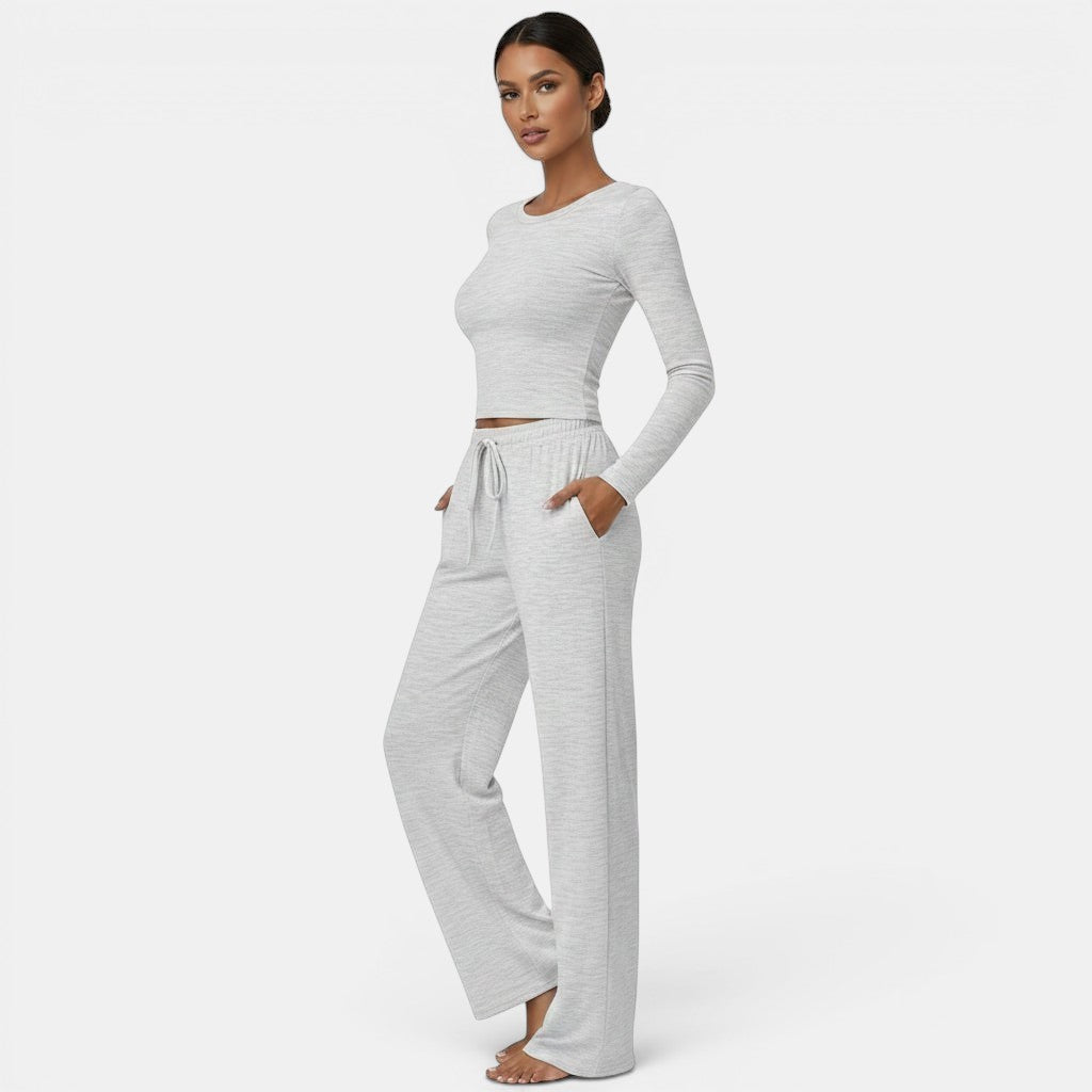 Allzom grey heathered long sleeve crop top and wide leg yoga pants set on a model.