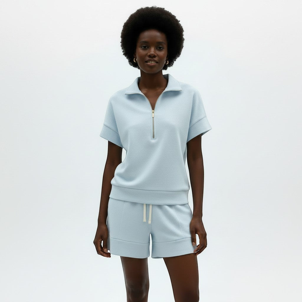 Allzom women's light blue short sleeve zip-neck sweatshirt and matching shorts set. Casual loungewear.
