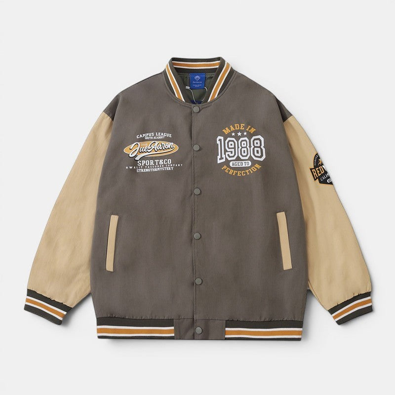 Allzom Men's American retro baseball jacket in grey with tan sleeves, featuring varsity-inspired patches and striped cuffs.