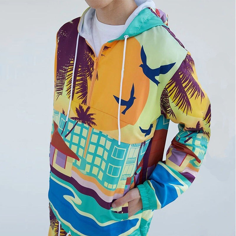 Allzom Men's two-piece set with a colourful graphic print hooded sweater and matching trousers. Features palm trees, birds, and buildings.
