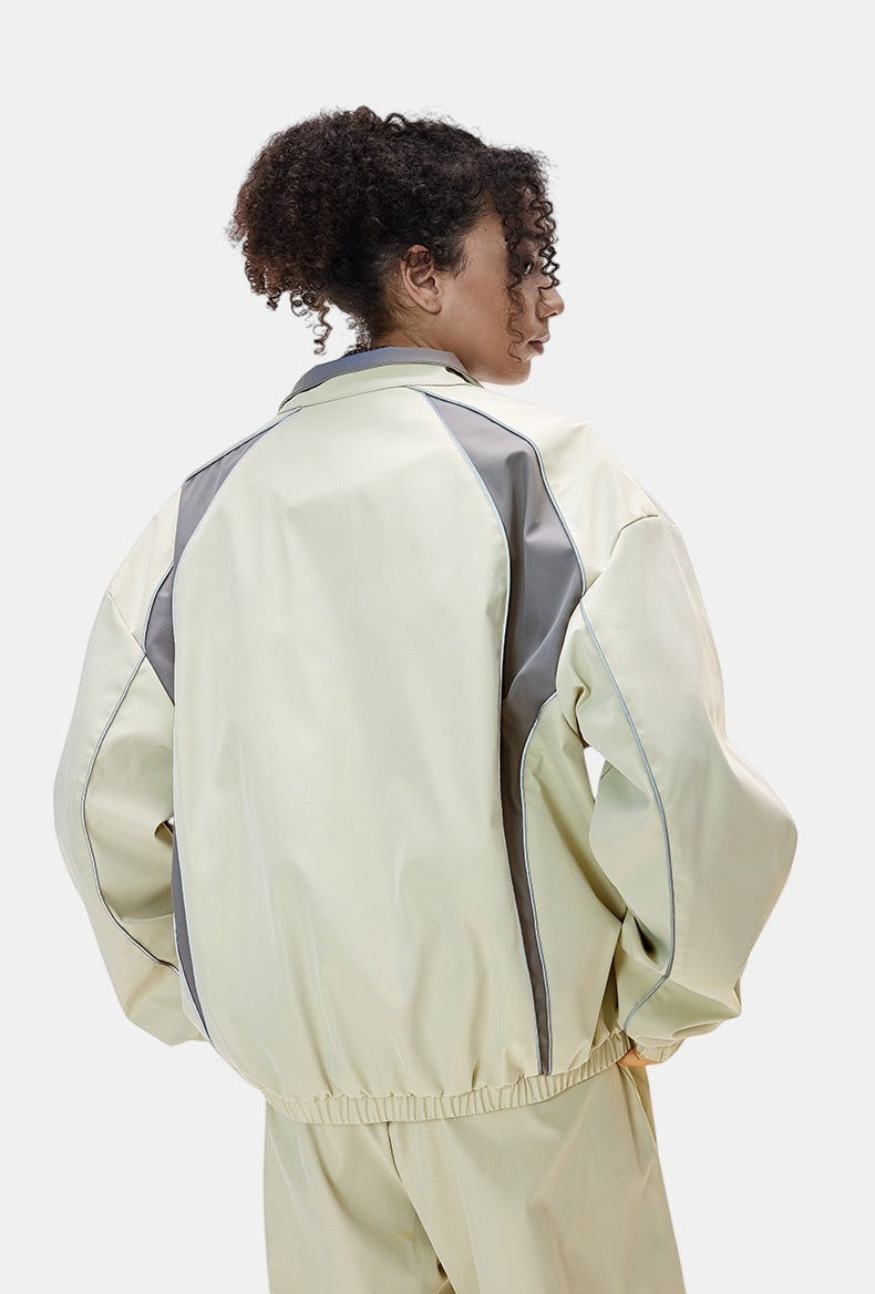 Allzom cream retro racing jacket with grey panel details and elasticated hem, paired with matching wide-leg pants.