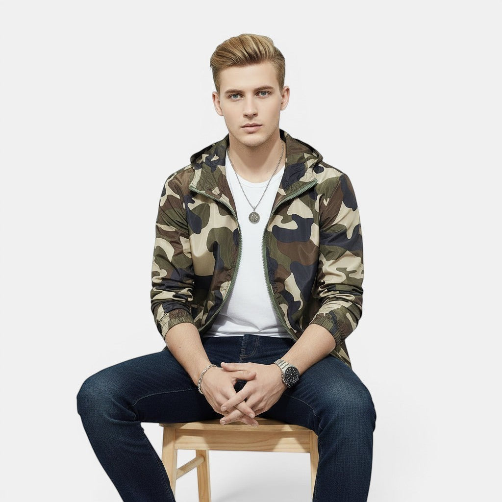 Allzom Men's slim fit camouflage jacket with hood, green and beige print, worn over a white t-shirt and dark jeans.