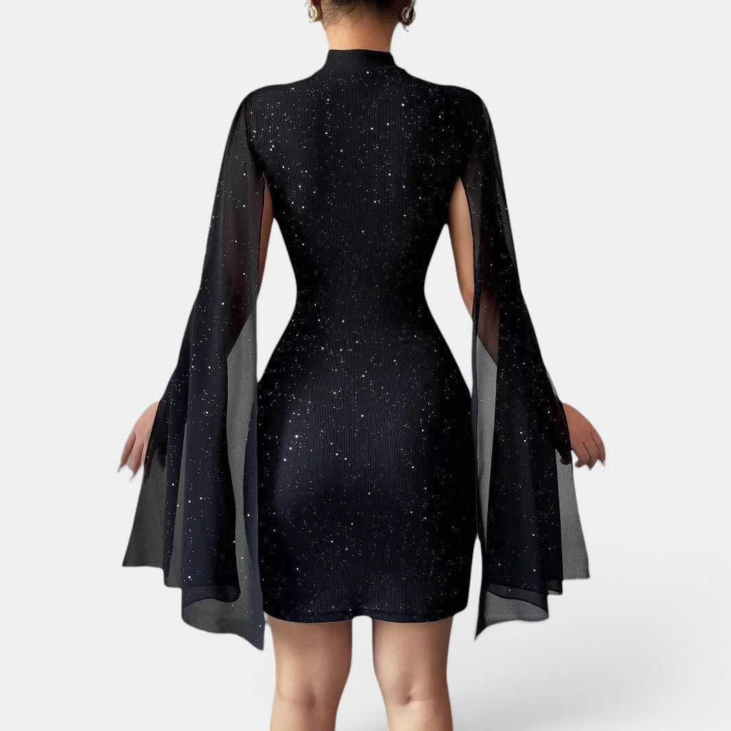 Vestido preto justo de festa da Allzom com decote redondo, mangas de chiffon tipo capa e detalhes de estrelas cintilantes.