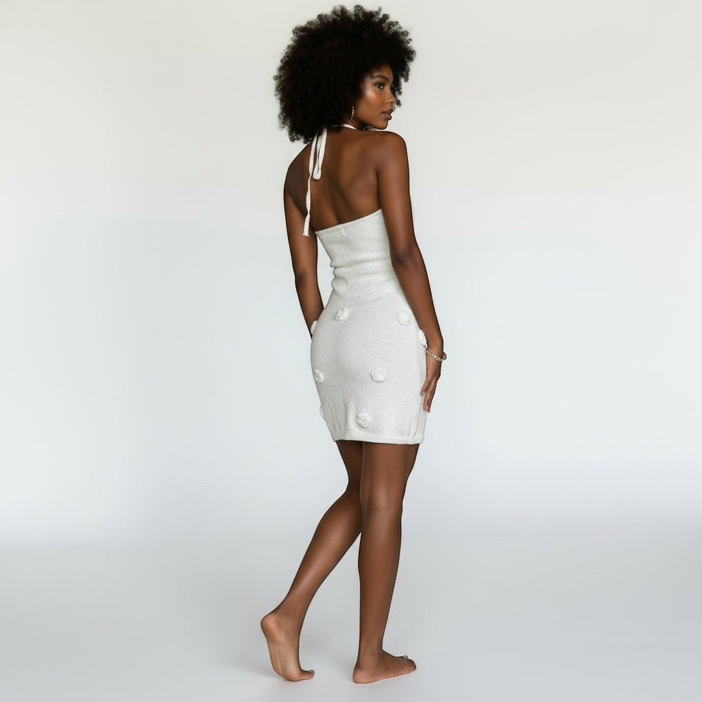 Allzom white halter neck mini dress with floral appliqué and backless design.