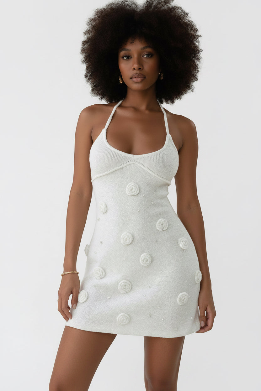 Allzom white knitted halter neck mini dress with floral appliqué and pearl details, backless design, waist-cinching silhouette.
