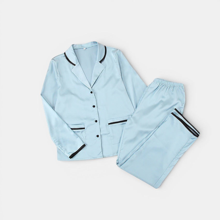 Allzom women's light blue satin pyjama set with black contrast piping on collar, cuffs and pockets.